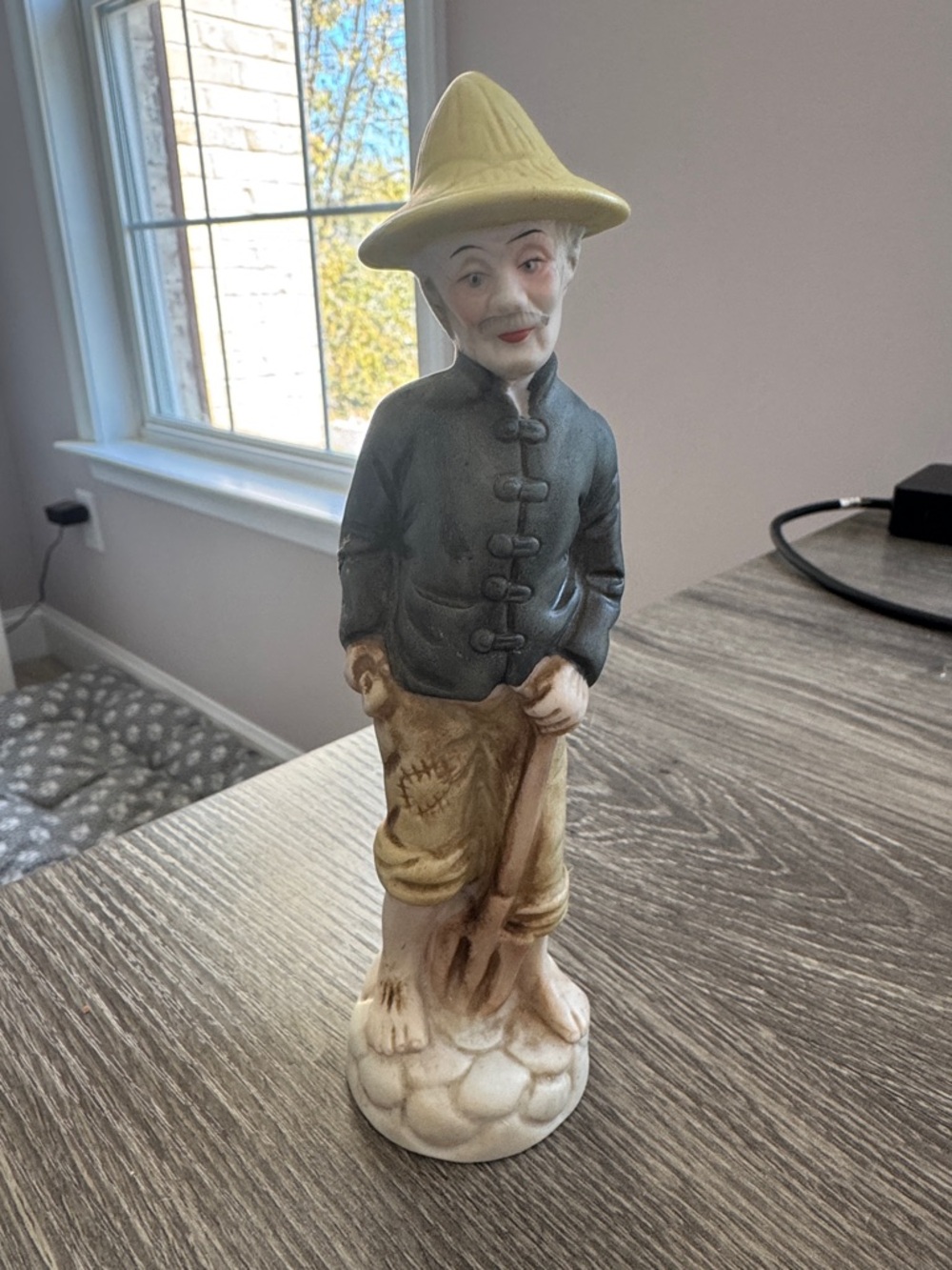 Hand-Painted Ceramic Figurine in Yellow, Blue, and Cream